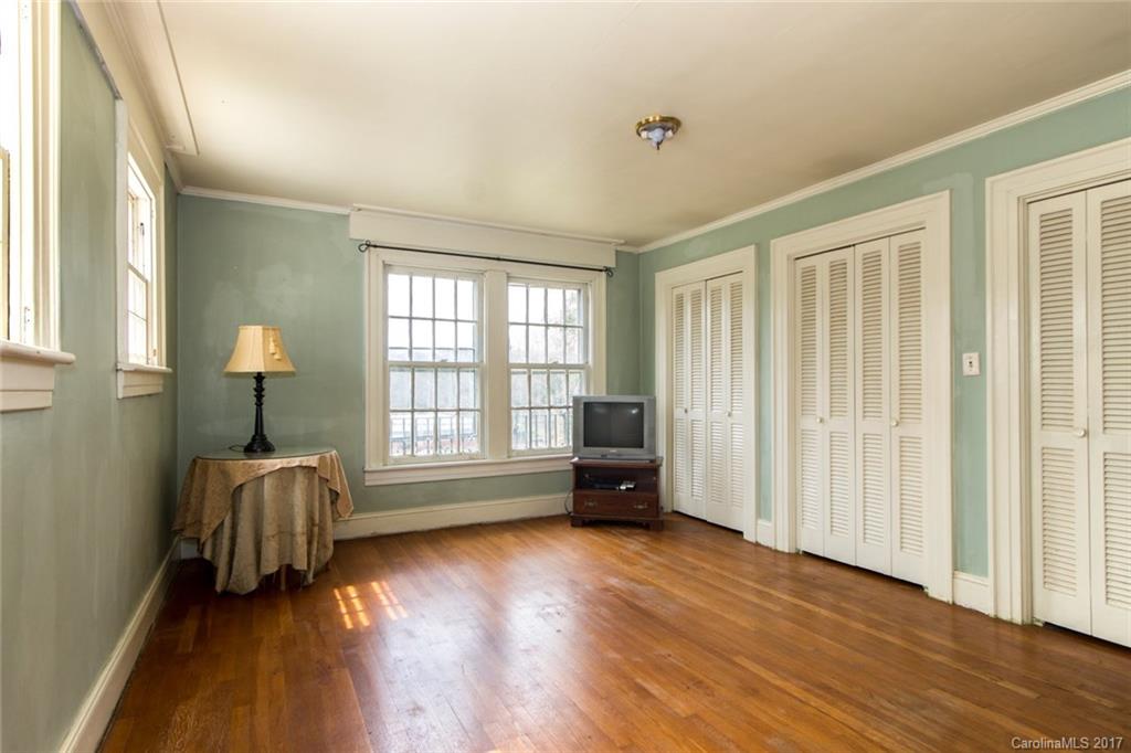 528 North Main Street Rutherfordton, NC 28139 - Photo 18 of 22 a view of an empty room with a window and wooden floor