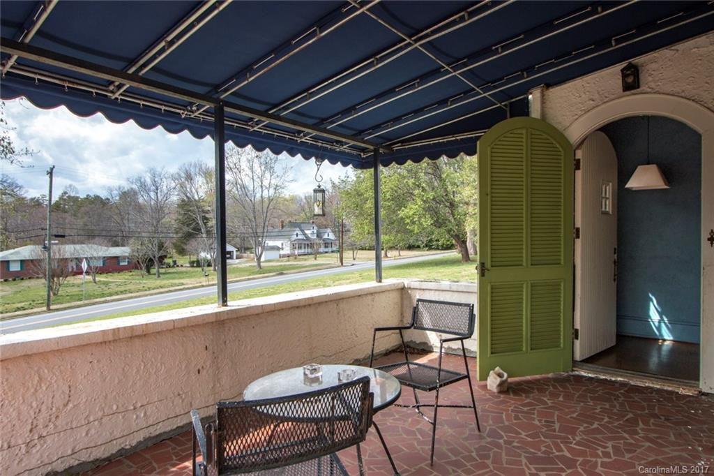 528 North Main Street Rutherfordton, NC 28139 - Photo 3 of 22 a view of a porch with furniture and a yard