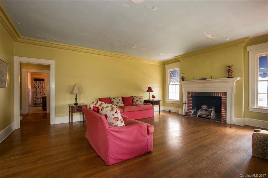528 North Main Street Rutherfordton, NC 28139 - Photo 4 of 22 a living room with furniture fireplace and wooden floor