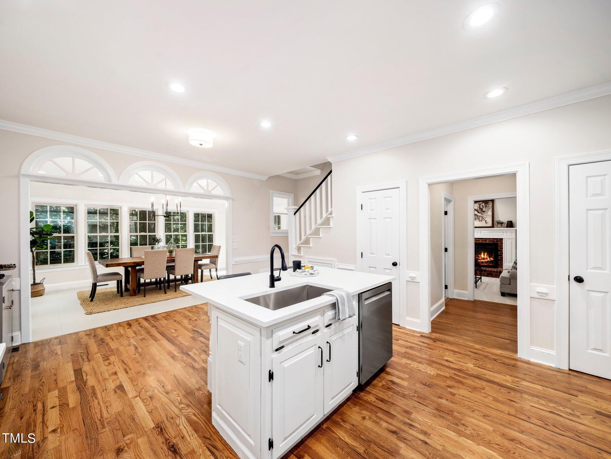 2900 Kenwick Court Raleigh, NC 27613 - Photo 11 of 34 a large white kitchen with sink and cabinets