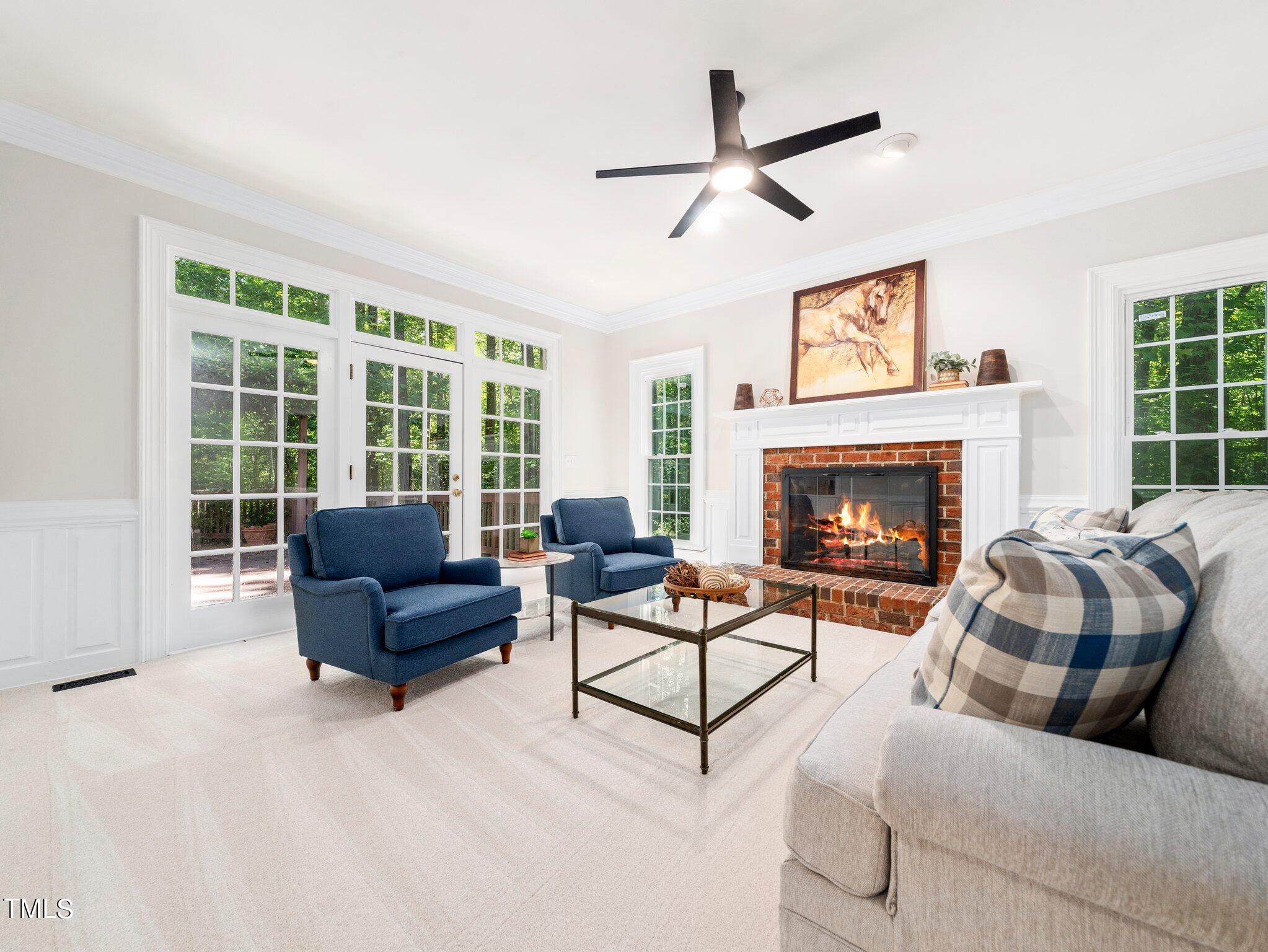2900 Kenwick Court Raleigh, NC 27613 - Photo 14 of 34 a living room with furniture and a fireplace