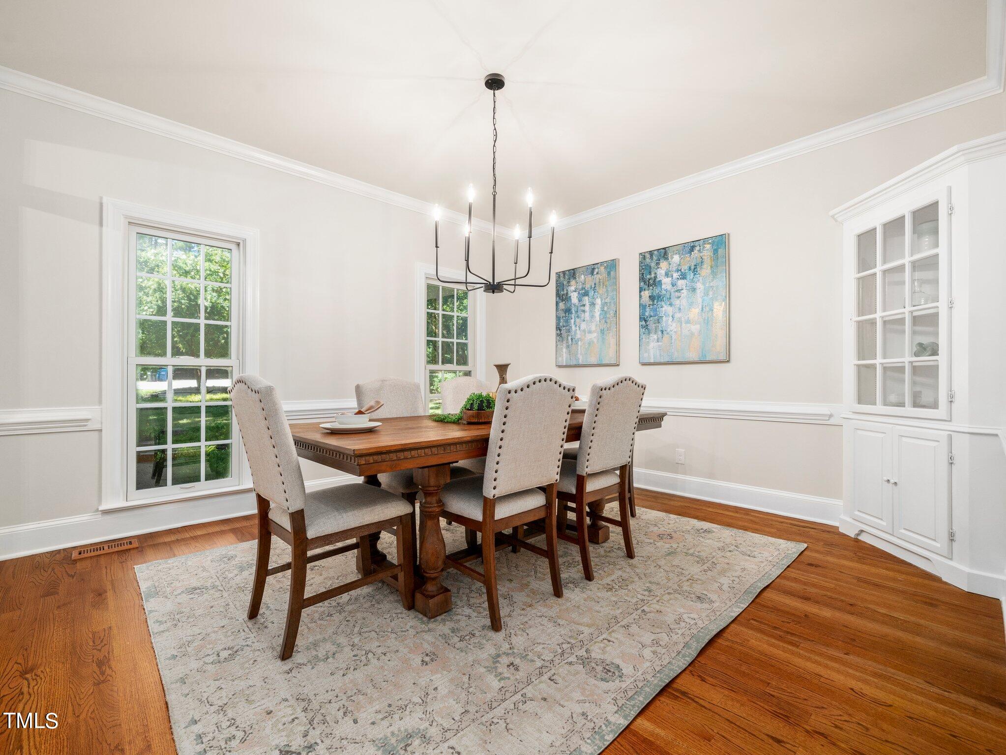 2900 Kenwick Court Raleigh, NC 27613 - Photo 6 of 34 a view of a dining room with furniture window and outside view