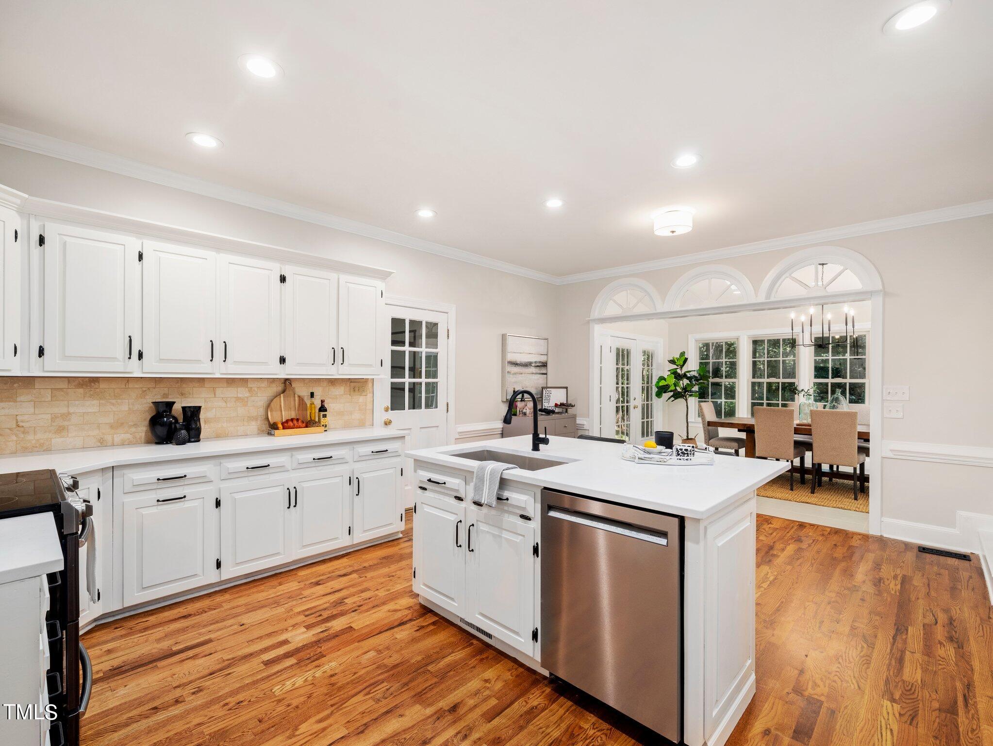 2900 Kenwick Court Raleigh, NC 27613 - Photo 10 of 34 a kitchen that has a sink and a stove in it