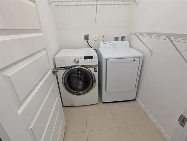 a utility room with dryer and washer