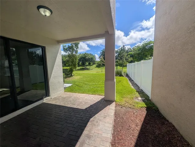 a view of a porch with a backyard