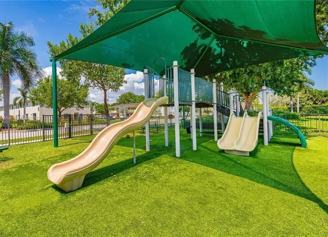 a view of a park with a slide