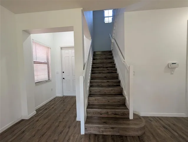 a view of entryway with wooden floor