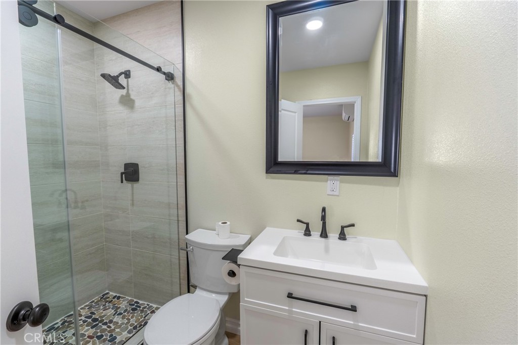 3895 Castleman Street Riverside, CA 92503 - Photo 19 of 22 a bathroom with a sink toilet and shower