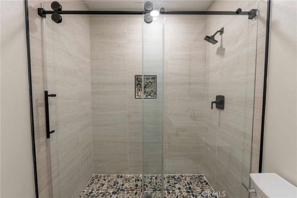 3895 Castleman Street Riverside, CA 92503 - Photo 20 of 22 a bathroom with a shower