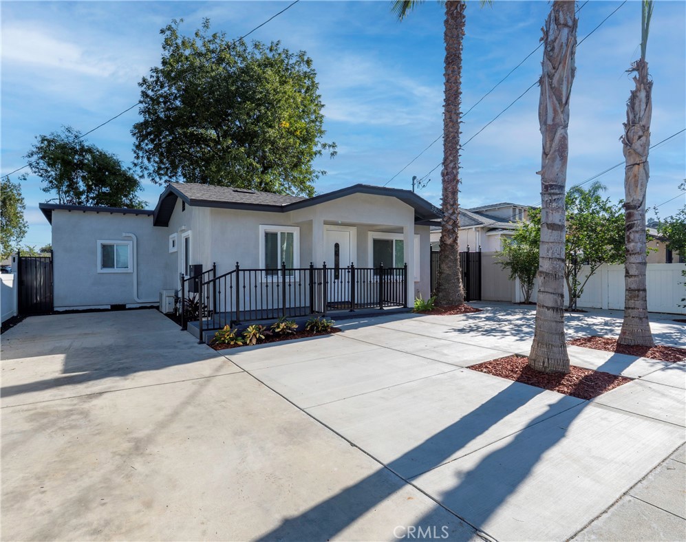 3895 Castleman Street Riverside, CA 92503 - Photo 2 of 22 a row of palm trees in front of house