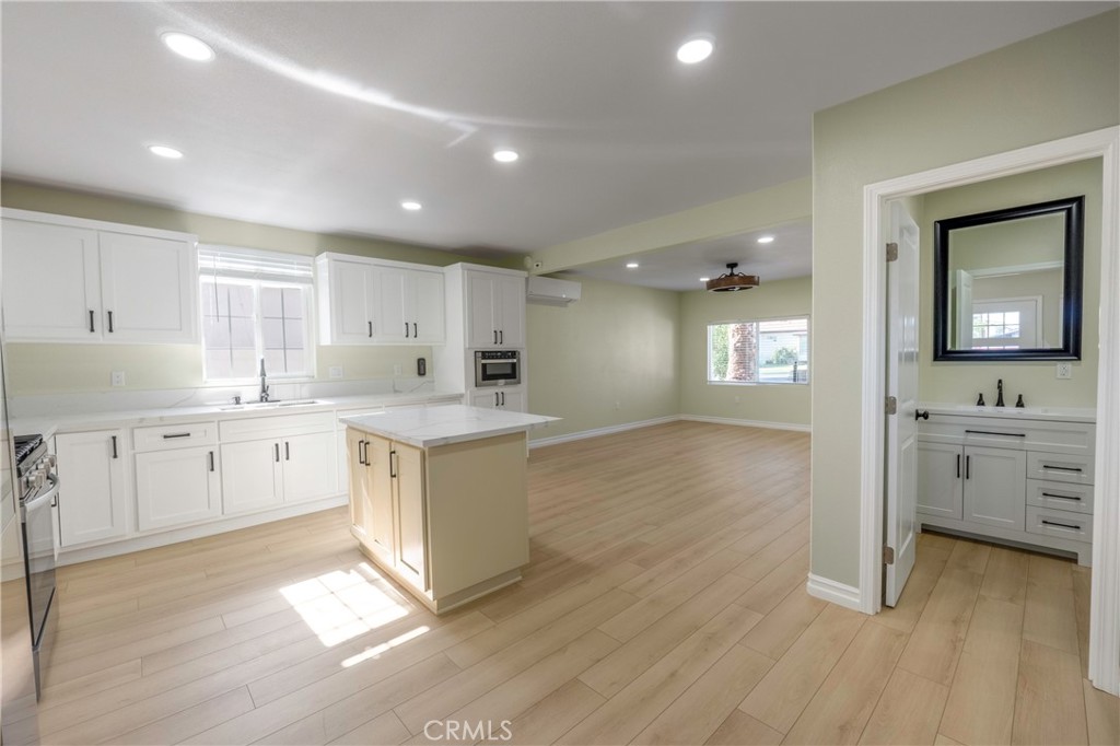 3895 Castleman Street Riverside, CA 92503 - Photo 7 of 22 a kitchen with white cabinets and sink