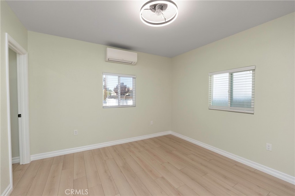 3895 Castleman Street Riverside, CA 92503 - Photo 8 of 22 an empty room with a workspace