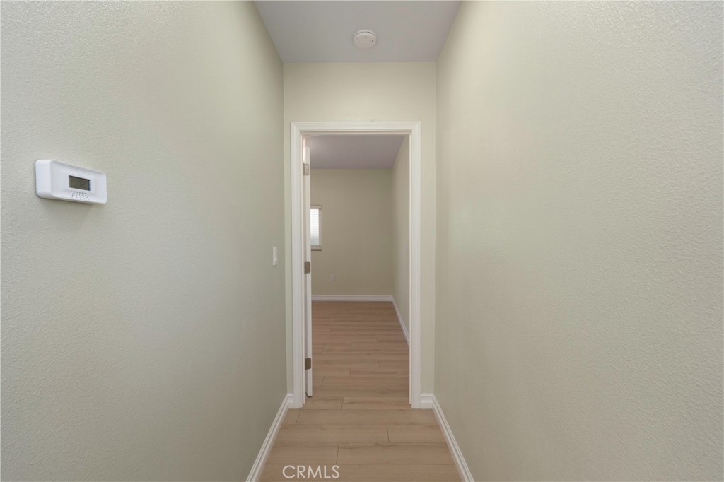 3895 Castleman Street Riverside, CA 92503 - Photo 10 of 22 a view of a hallway with wooden floor