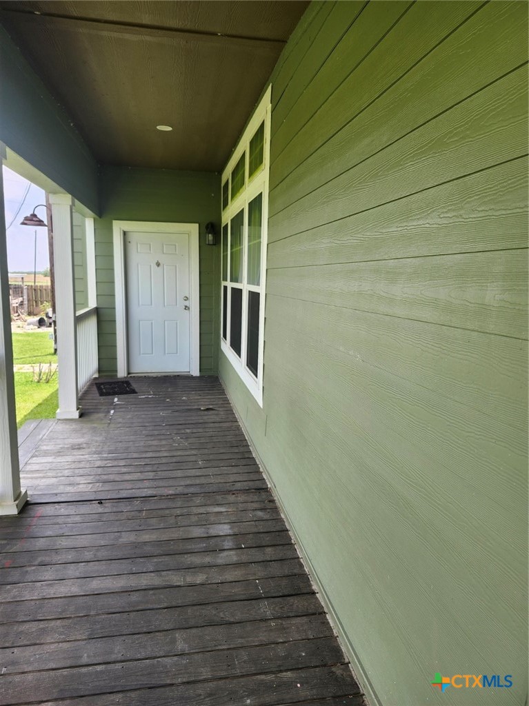1845 Royal Road Port Lavaca, TX 77979 - Photo 17 of 22 a view of a hallway with wooden floor