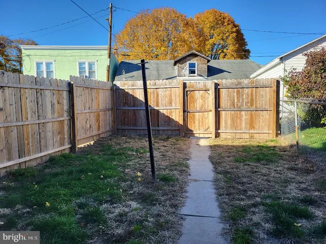 a kitchen with a refrigerator and cabinets