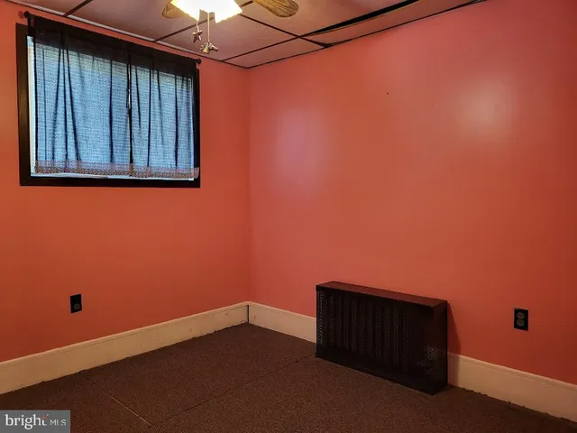 a white toilet sitting next to a shower curtain