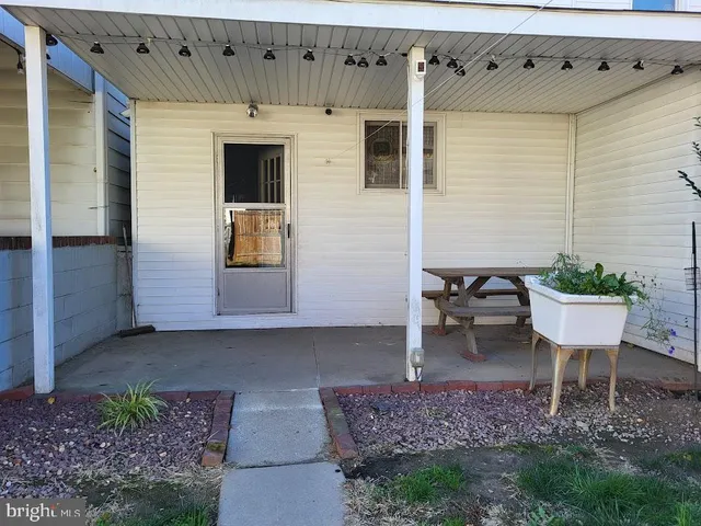 a kitchen with wooden cabinets and sink