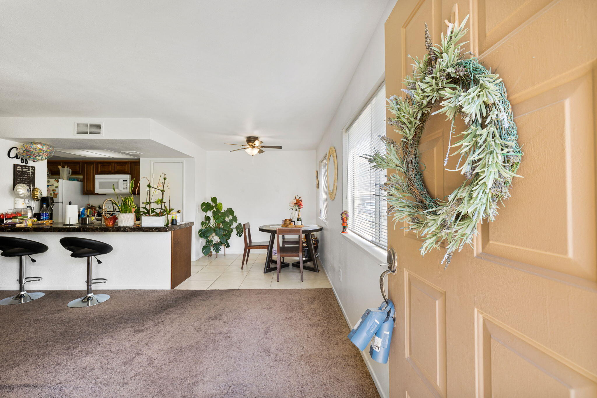 72632 Raven Road, Unit 2 Palm Desert, CA 92260 - Photo 1 of 30 a living room with furniture and a chandelier
