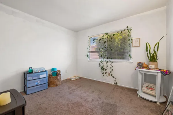 a view of room with furniture and window