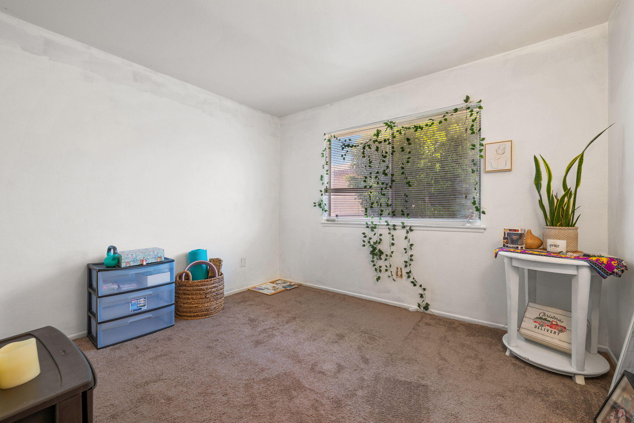 72632 Raven Road, Unit 2 Palm Desert, CA 92260 - Photo 15 of 30 a view of room with furniture and window