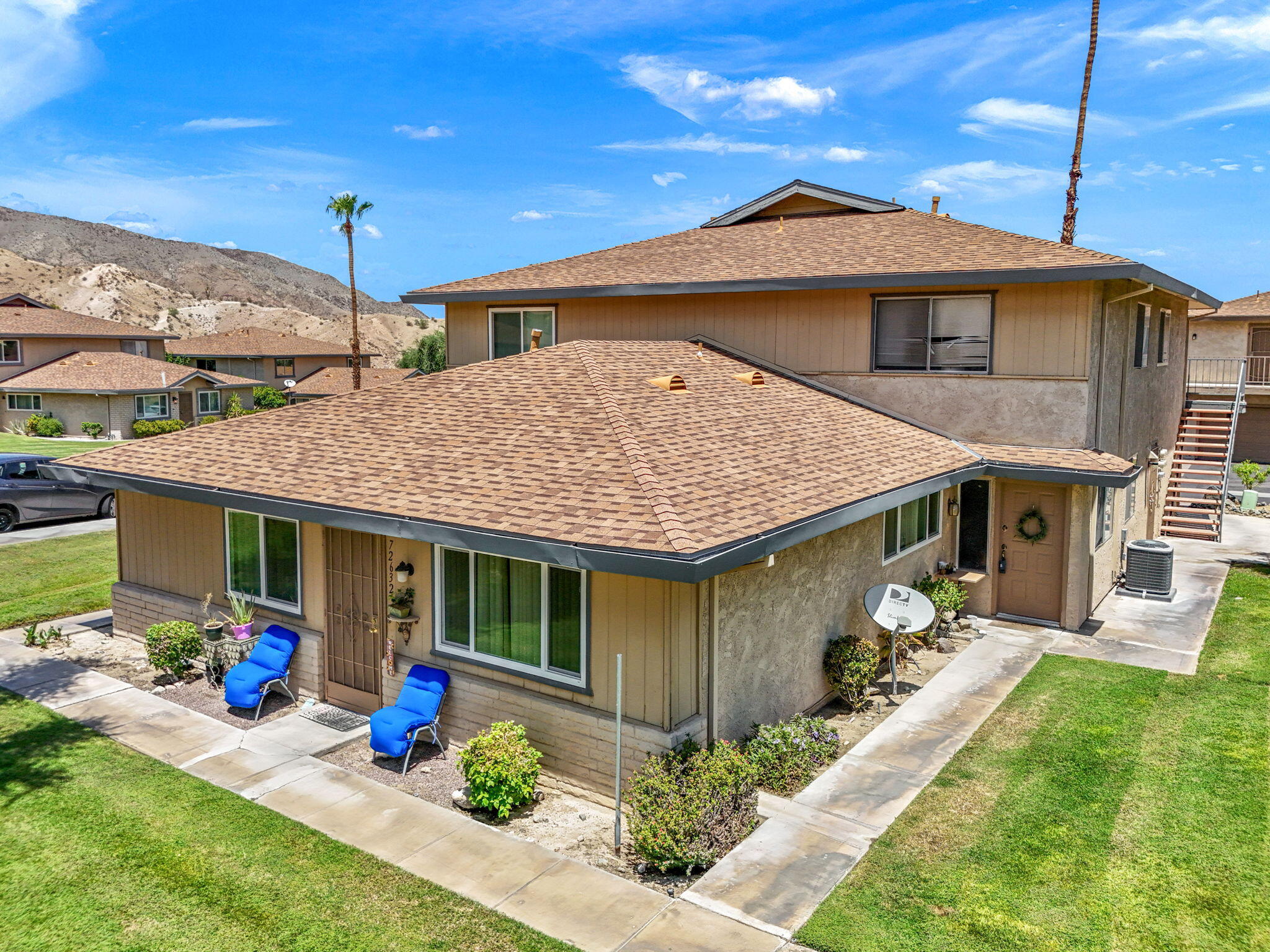 72632 Raven Road, Unit 2 Palm Desert, CA 92260 - Photo 21 of 30 a front view of a house with garden