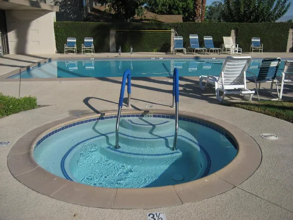 a view of a swimming pool with a chairs