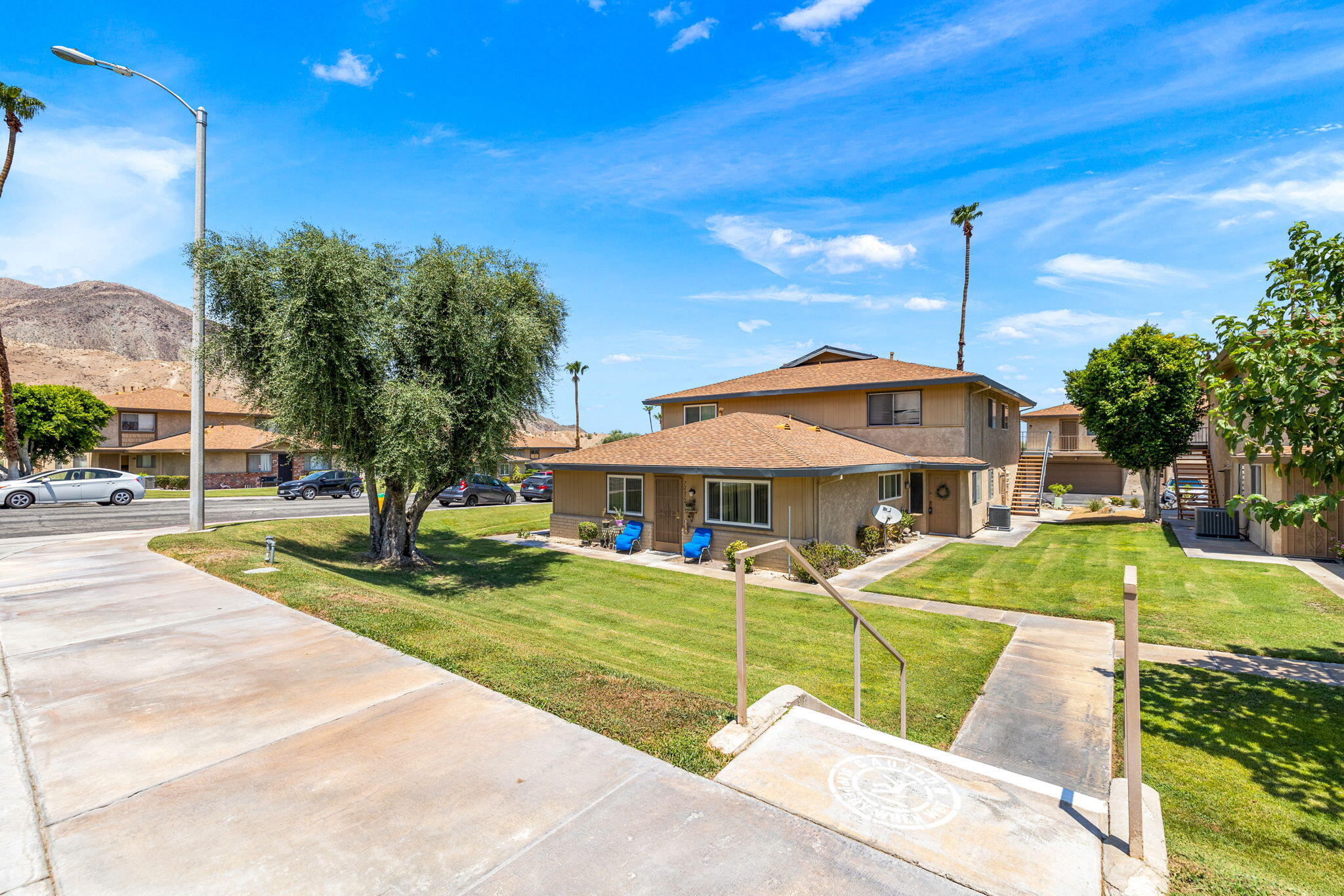 72632 Raven Road, Unit 2 Palm Desert, CA 92260 - Photo 26 of 30 a front view of a house with garden
