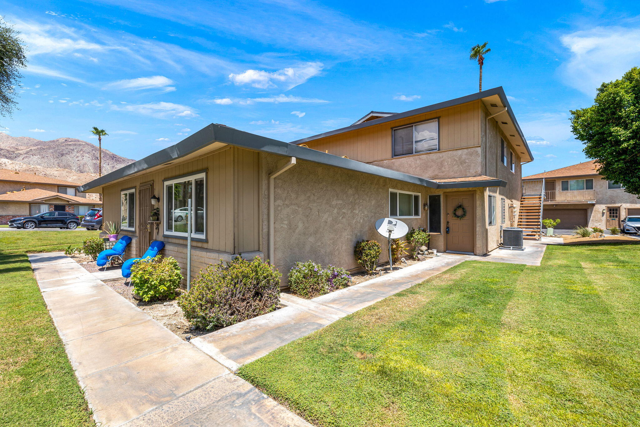 72632 Raven Road, Unit 2 Palm Desert, CA 92260 - Photo 27 of 30 a front view of a house with patio