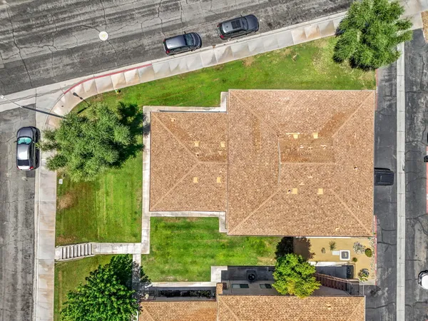 a view of a back yard with a street