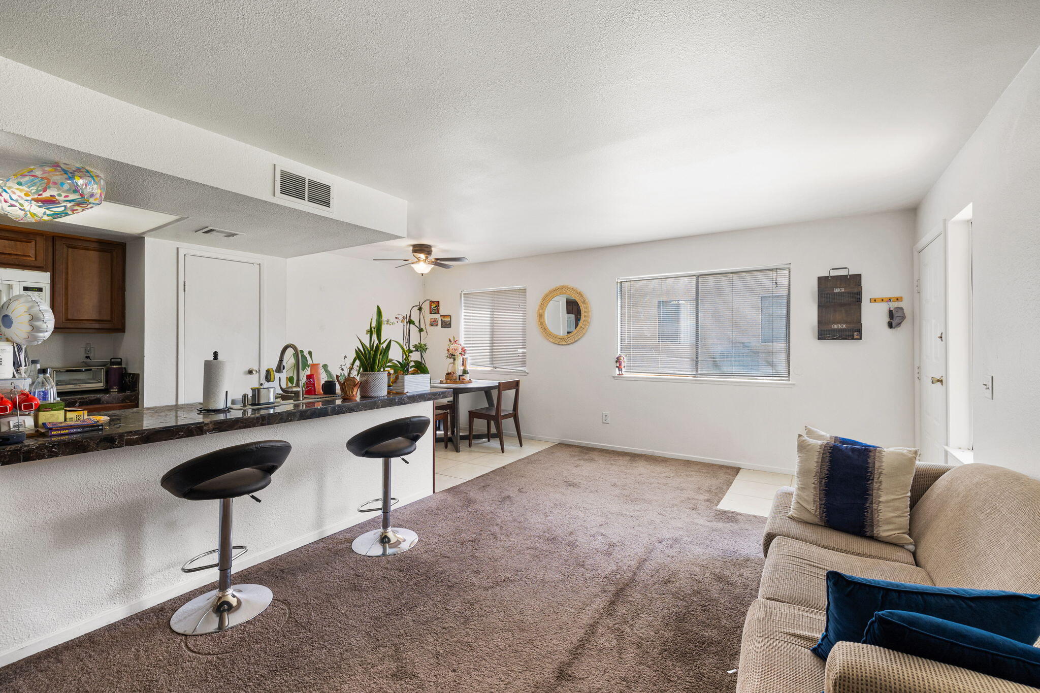 72632 Raven Road, Unit 2 Palm Desert, CA 92260 - Photo 4 of 30 a view of a livingroom with furniture and a couch