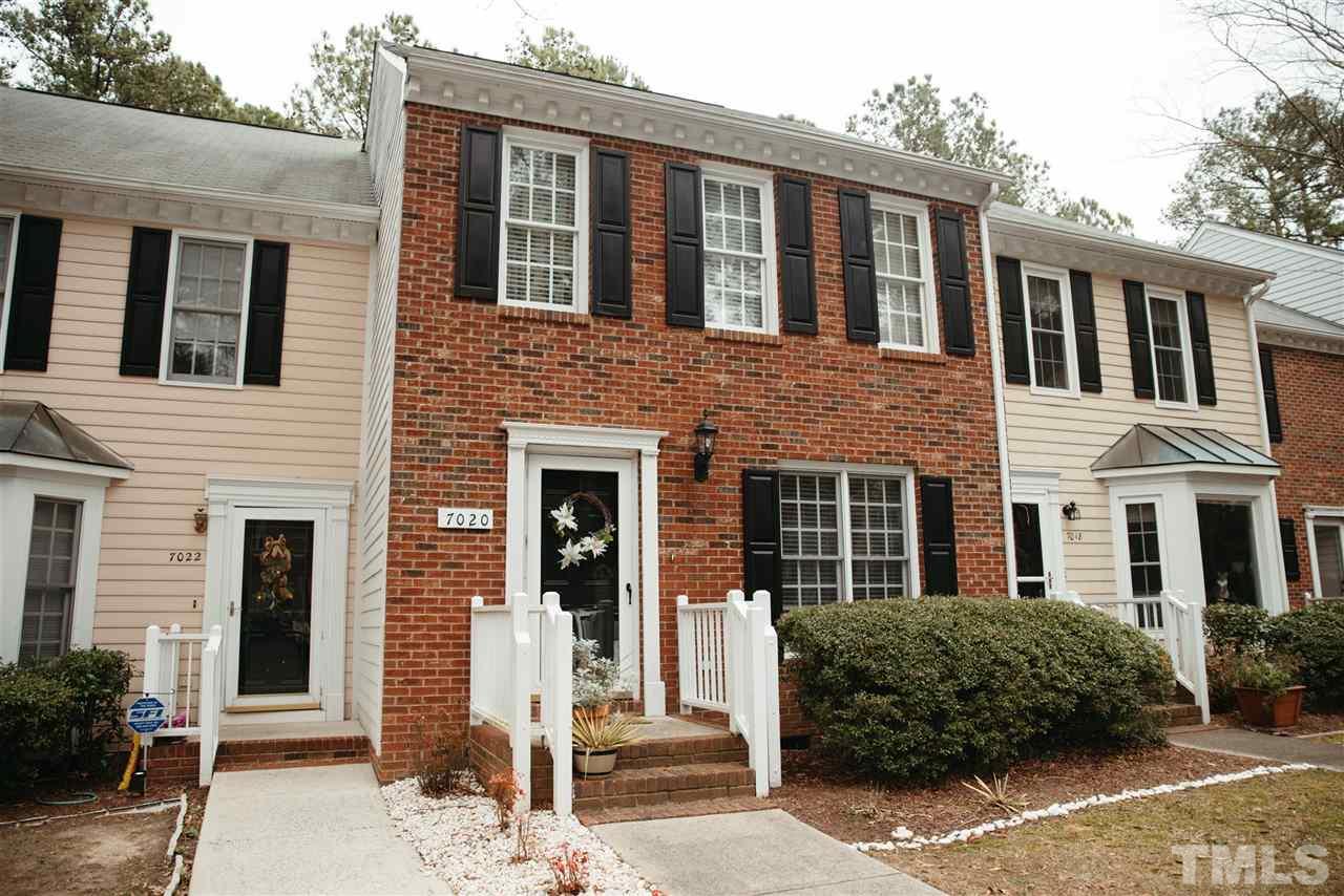 7020 Epping Forest Drive Raleigh, NC 27613 - Photo 1 of 29 a front view of a house with a garden