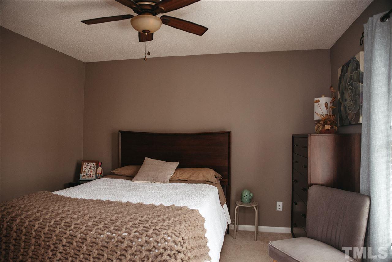 7020 Epping Forest Drive Raleigh, NC 27613 - Photo 11 of 29 a bedroom with a bed and window