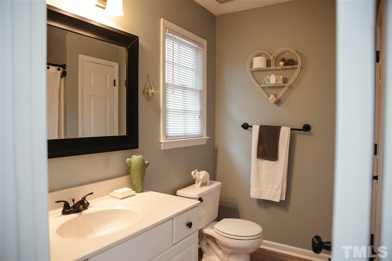 7020 Epping Forest Drive Raleigh, NC 27613 - Photo 12 of 29 a bathroom with a sink toilet and mirror