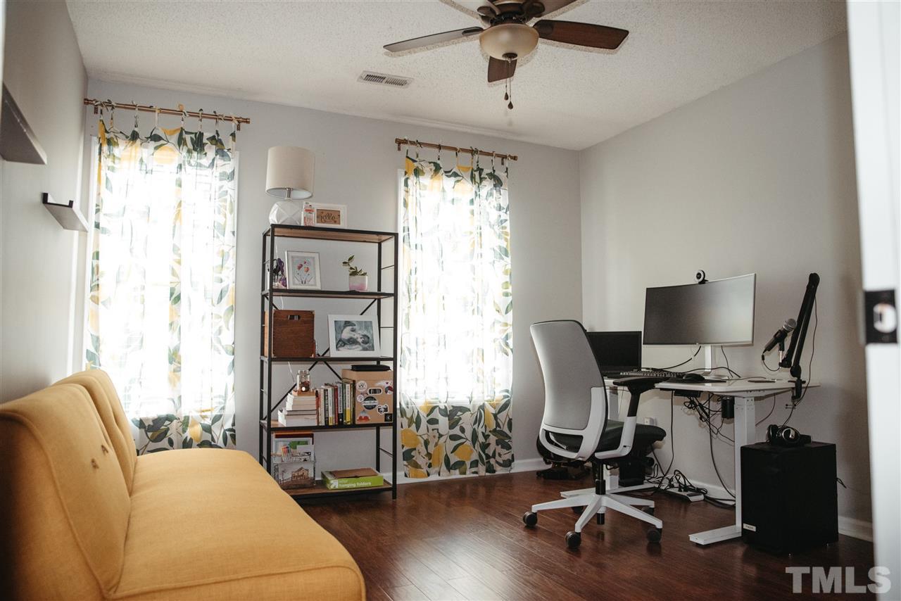 7020 Epping Forest Drive Raleigh, NC 27613 - Photo 15 of 29 a view of a workspace with furniture and a window