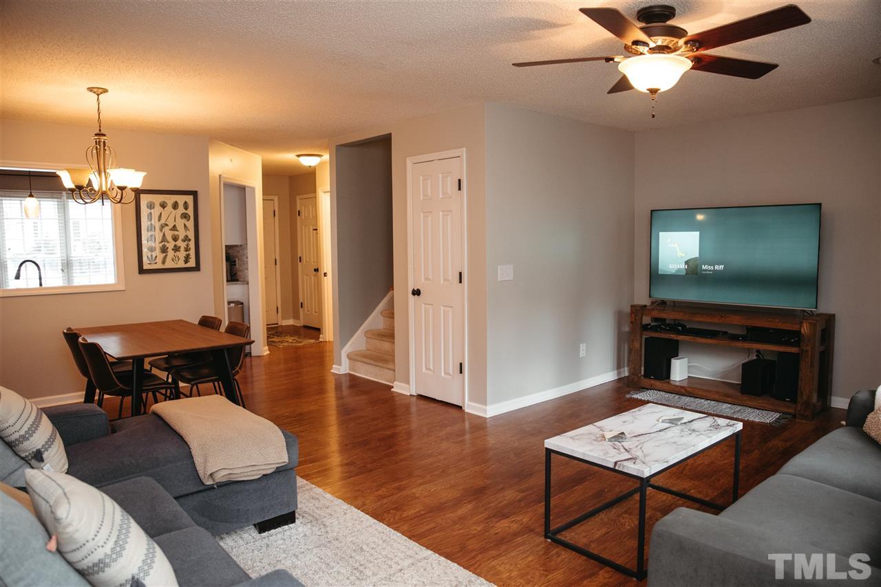 7020 Epping Forest Drive Raleigh, NC 27613 - Photo 5 of 29 a living room with furniture and a flat screen tv