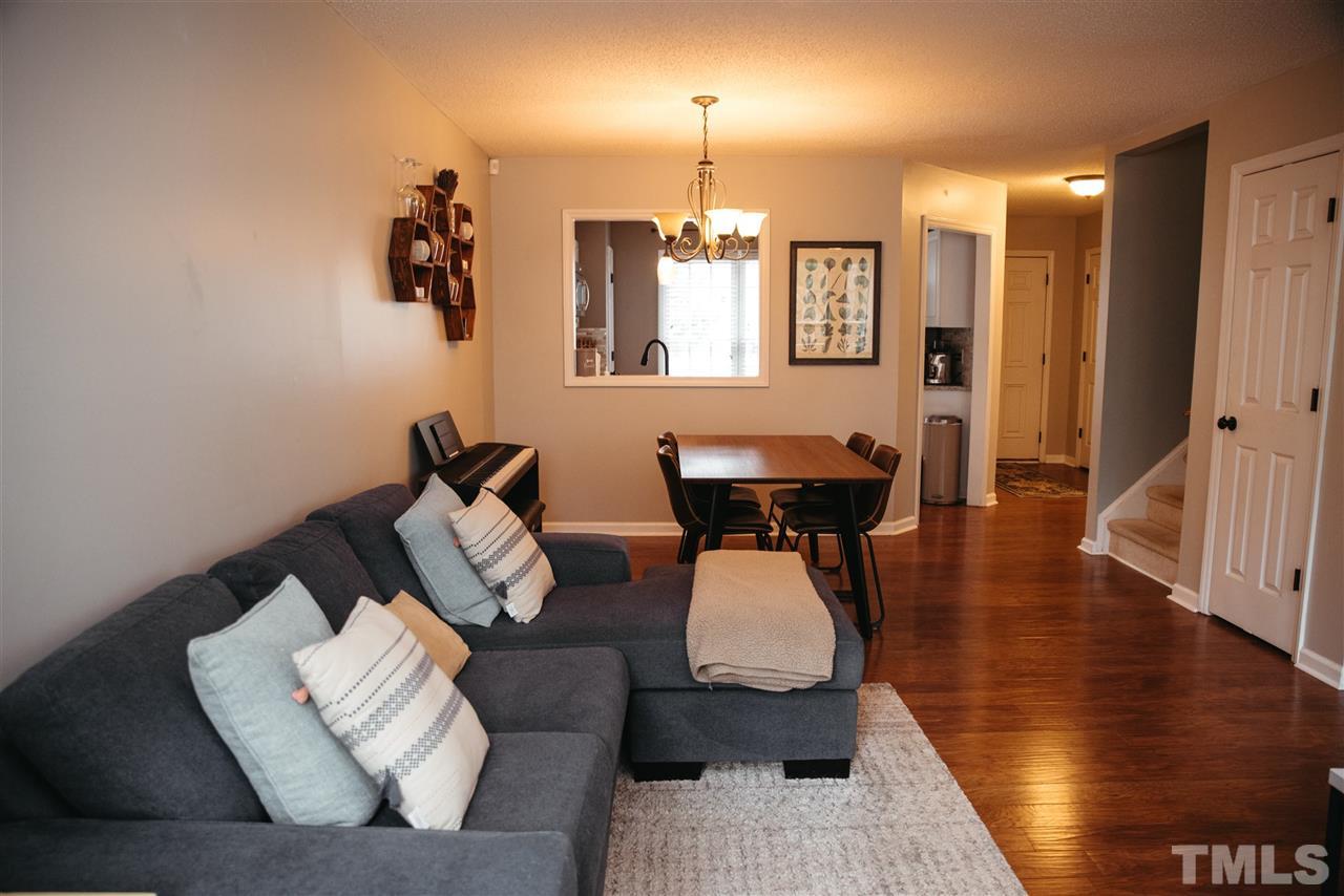 7020 Epping Forest Drive Raleigh, NC 27613 - Photo 6 of 29 a living room with furniture and wooden floor
