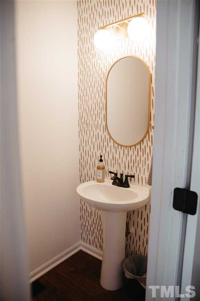7020 Epping Forest Drive Raleigh, NC 27613 - Photo 8 of 29 a bathroom with a sink and a mirror