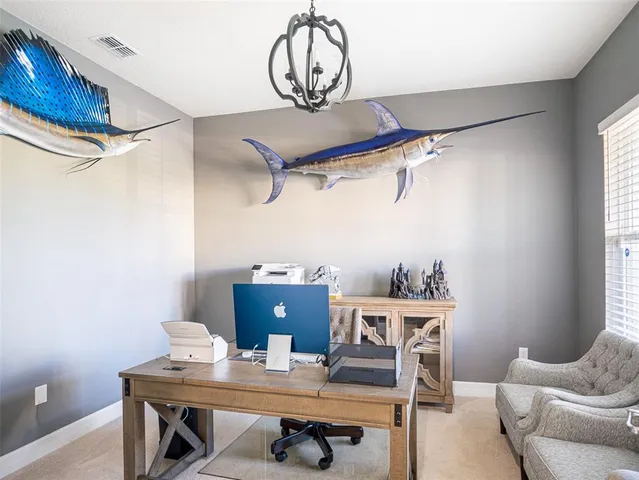 a view of a dining room with furniture
