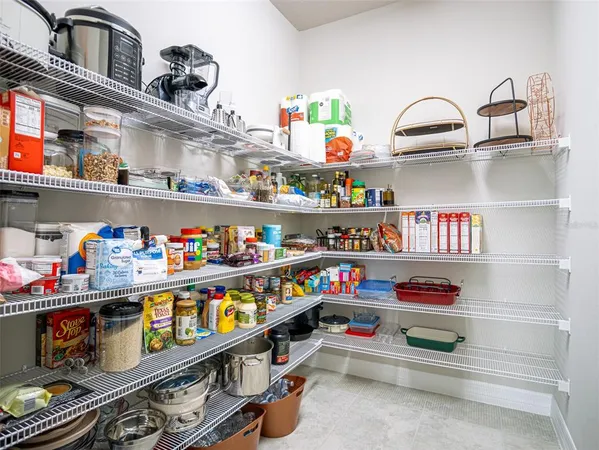 a living room with furniture a lamp and a window