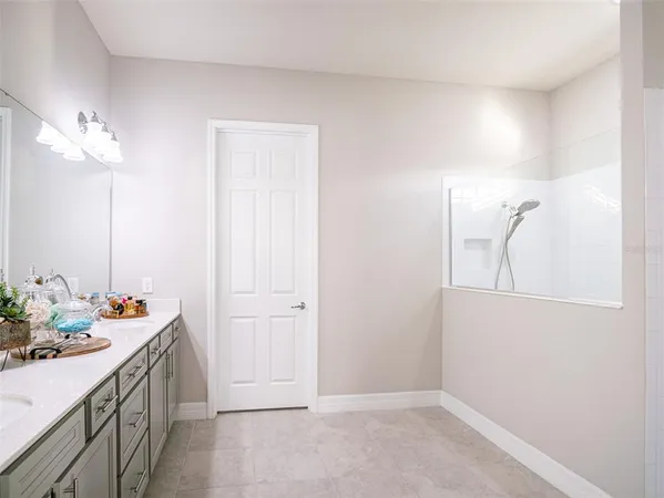 a bedroom with a bed and a ceiling fan