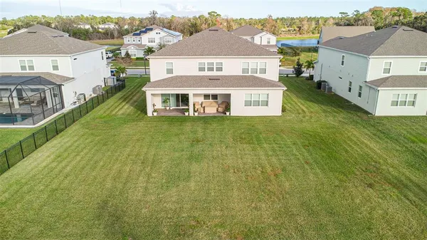 a view of swimming pool with a garden and seating area