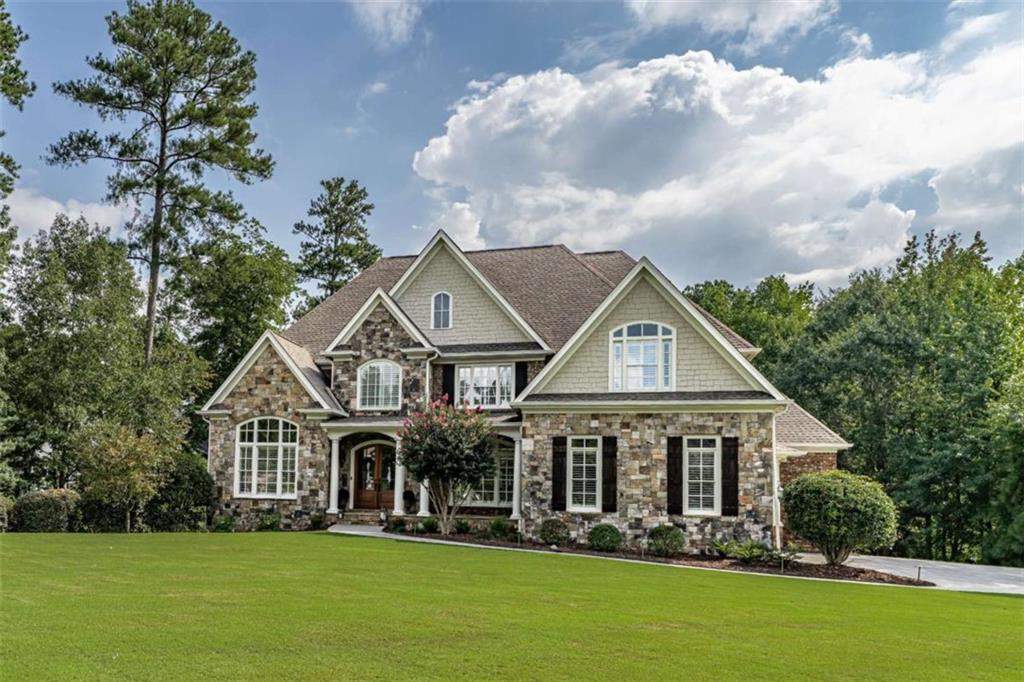 138 Nelson Boulevard Northwest Rome, GA 30165 - Photo 1 of 39 a front view of a house with garden