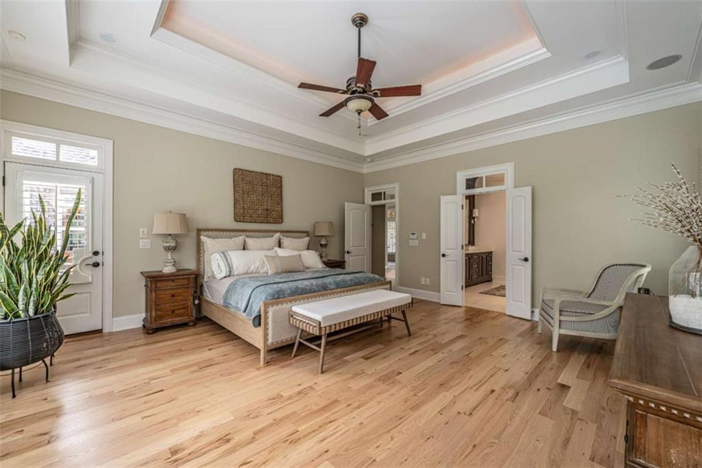138 Nelson Boulevard Northwest Rome, GA 30165 - Photo 16 of 39 a living room with a bed furniture and a wooden floor