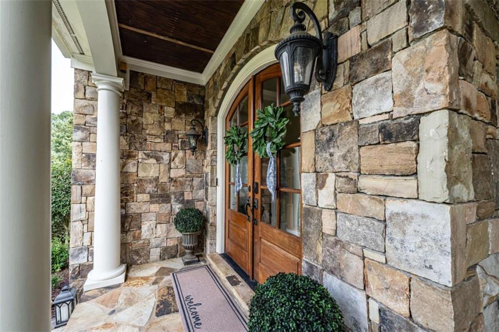 138 Nelson Boulevard Northwest Rome, GA 30165 - Photo 2 of 39 a view of path along with brick wall and potted plants