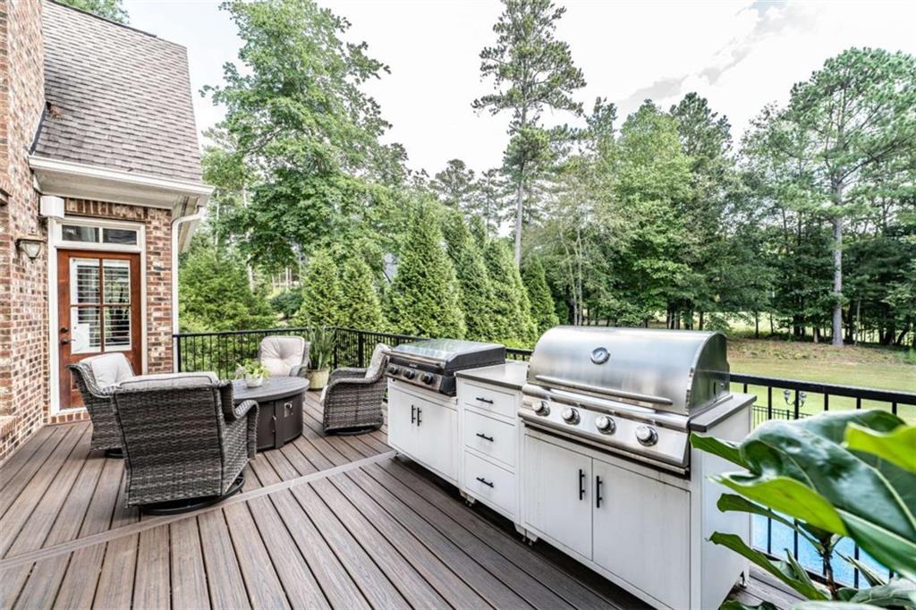 138 Nelson Boulevard Northwest Rome, GA 30165 - Photo 22 of 39 a view of a patio with table and chairs and wooden floor