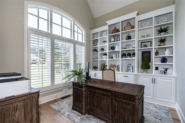 a bathroom with a sink a mirror and vanity