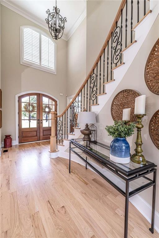 138 Nelson Boulevard Northwest Rome, GA 30165 - Photo 25 of 39 a living room with stairs and a wooden floor