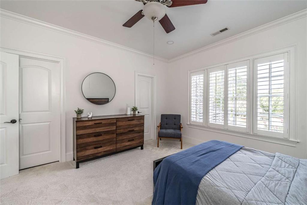 138 Nelson Boulevard Northwest Rome, GA 30165 - Photo 27 of 39 a bed room with a bed closet and flat tv screen