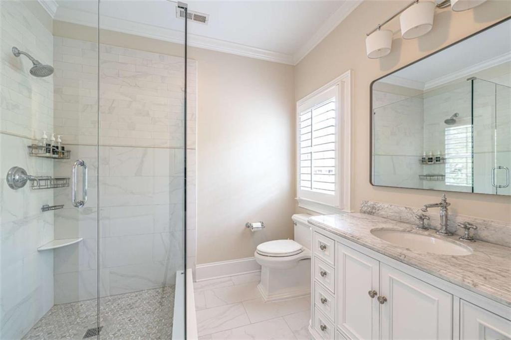 138 Nelson Boulevard Northwest Rome, GA 30165 - Photo 28 of 39 a bathroom with a granite countertop sink a toilet and shower