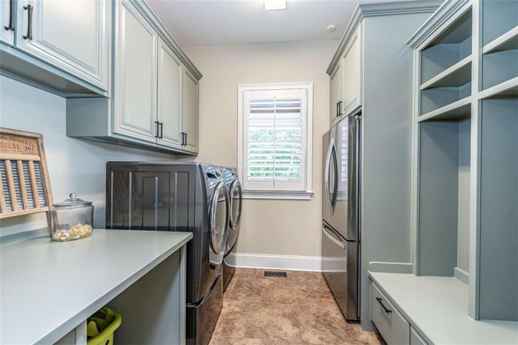 138 Nelson Boulevard Northwest Rome, GA 30165 - Photo 31 of 39 a kitchen with stainless steel appliances granite countertop a refrigerator a sink and white cabinets